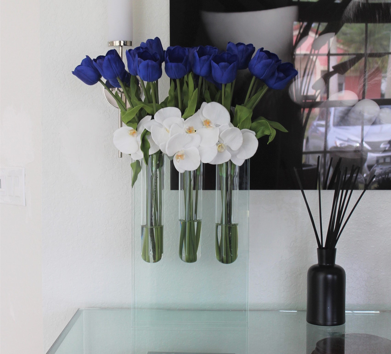 Triple bud vase with blue tulips